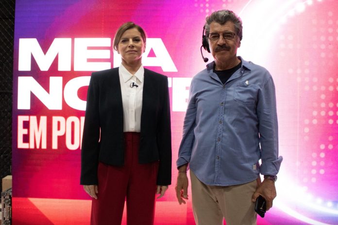 Amor e política: Caio Blat estreia como diretor em “O debate” Paula (Debora Bloch) e Marcos (Paulo Betti) nos bastidores do telejornal. Still. Reprodução